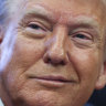 President Donald Trump listens in the Oval Office at the White House in Washington.