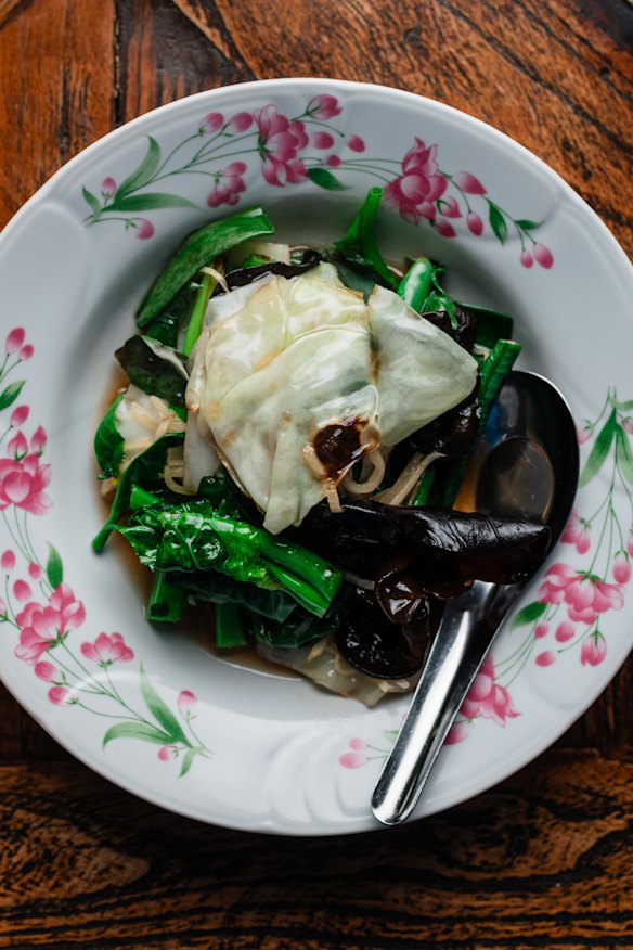 Stir-fried Asian greens with ginger and mushrooms.