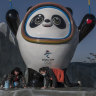 Workers clean the Beijing 2022 Winter Olympics mascot.
