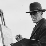 Artist John Wardell Power painting at his easel in NSW in the 1930s. 