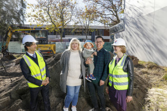 Developer Charles Daoud, affordable housing tenant Jo Fisher, private buyer Paul Tran and his son Pax, and Housing Trust CEO Michele Adair at the site of Northsea in Wollongong.
