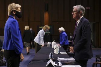 Senator Elizabeth Warren speaks with US Fed chief Jerome Powell during a Senate Banking, Housing and Urban Affairs Committee hearing in Washington.