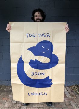 Artist Peter Drew and his Hugs poster.