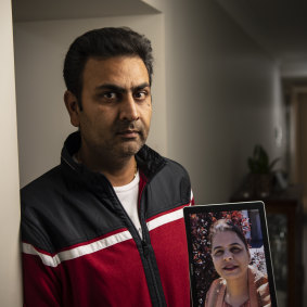 Baljit Khare with a photo of his wife.
