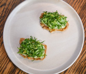 Chicken skin crisps with whipped anchovy and chicory at Embla.