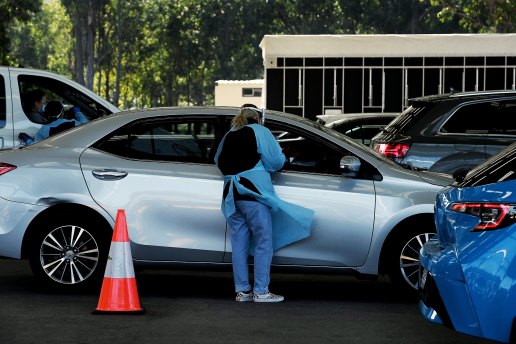 SydPath staff members carrying out COVID-19 tests at the Fairfield Showgrounds last month.