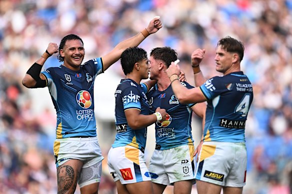 The Titans celebrate an AJ Brimson try.