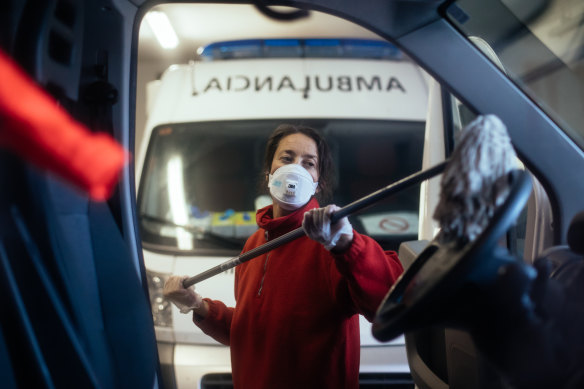 A Spanish Red Cross worker disinfects a vehicle in Huesca.