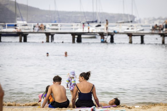 Families enjoy Balmoral Beach on Wednesday. 