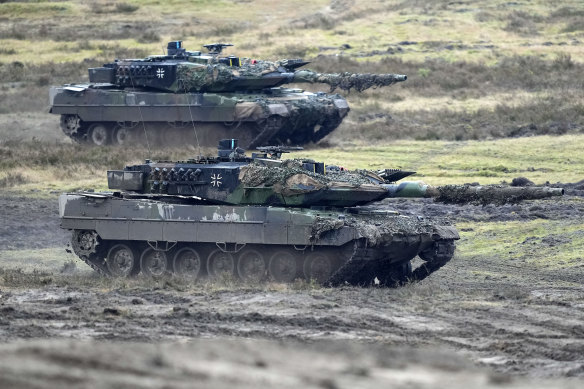Two Leopard 2 tanks are seen in action during a visit of German Defence Minister Boris Pistorius at the Bundeswehr tank battalion 203 at the Field Marshal Rommel Barracks in Augustdorf, Germany.