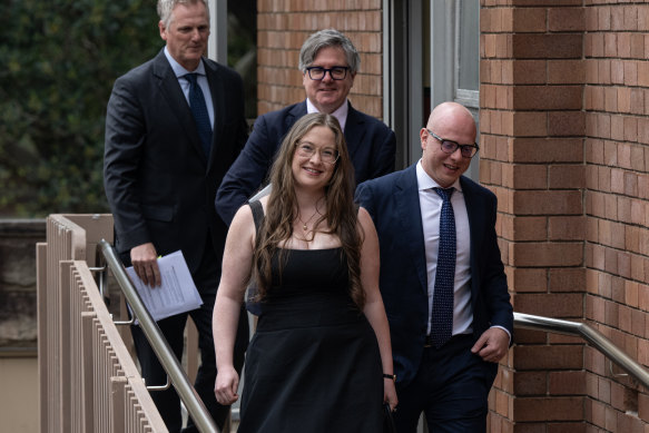 Paula Hitchcock and her husband, Nassib Thoumi, leave court after Wednesday’s decision.