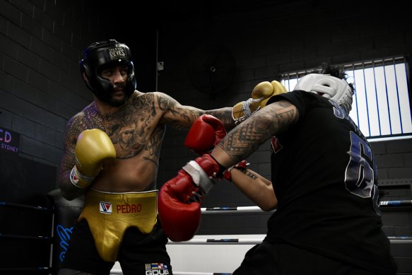 Tyson Pedro (yellow gloves) with Ibrahim Lane Saipaia at Bro Fit in Penrith ahead of his debut fight. 