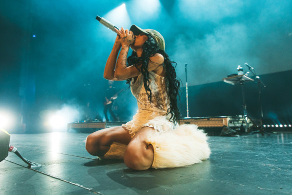 The TikTok sensation often kneels on stage, which removes her from the sight of many audience members.
