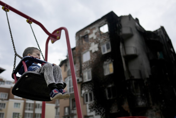 A boy at a playground in Irpin on the outskirts of Kyiv in May.