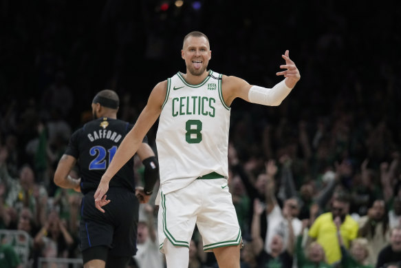 Boston Celtics center Kristaps Porzingis (8) celebrates.