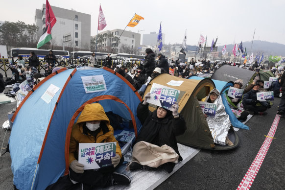 Protesters demand Yoon Suk Yeol’s arrest during a rally near the presidential residence in Seoul on Monday.