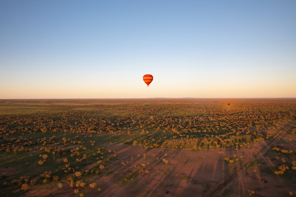 The view from above – hot-air ballooning and the spectacular dawn colours of the MacDonnell Ranges.