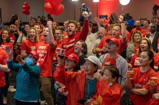 Labor Party supporters cheer after the ABC projects an ALP win  on November 26.