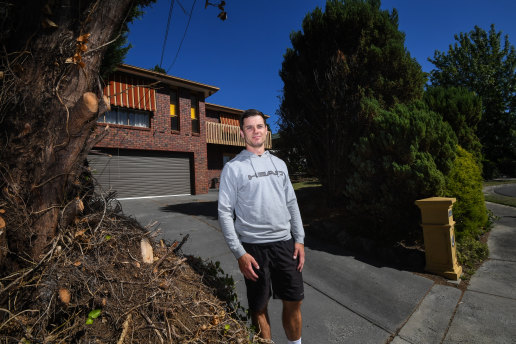 Rob Lewis who lives in Pin Oak Court, Vermont South, in front of one of the houses where Neighbours is filmed.