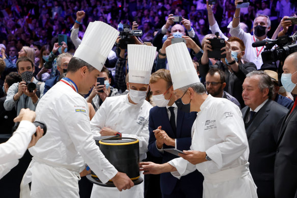 French President Emmanuel Macron treats his nation’s culinary traditions as an art of diplomacy. He is seen here judging a lunchbox at the Bocuse d’Or gastronomy competition in Lyon in September 2021. 
