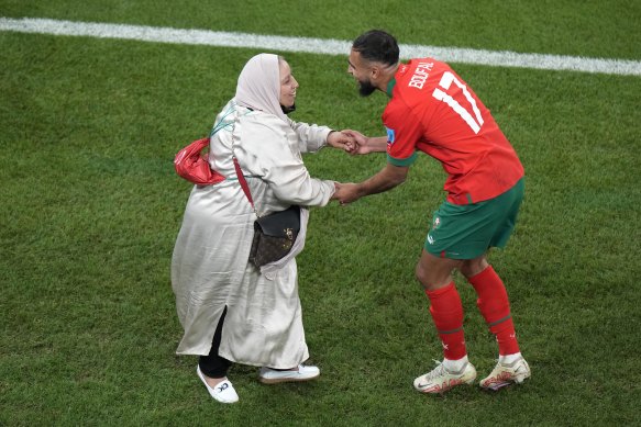 Morocco’s Sofiane Boufal celebrates with his mother after his team’s win over Portugal in the quarter-finals.
