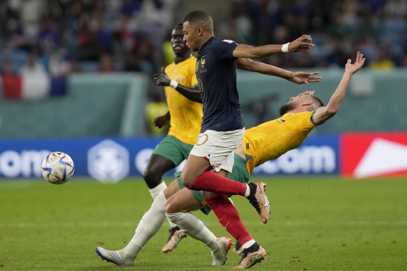 Kylian Mbappe leaves behind Australia’s Milos Degenek.