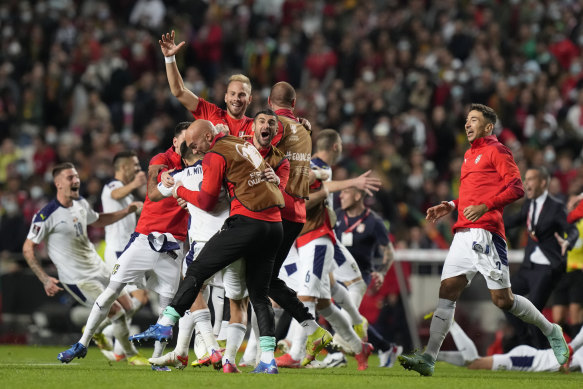 Serbian players celebrate their win and place in the World Cup.