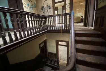 The main central staircase inside Home at Kangaroo Point appears in reasonably good condition, despite 119 years of use.