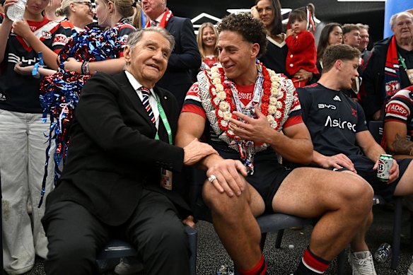 Roosters chairman Nick Politis with Mark Nawaqanitawase in the sheds after the grand final victory last Sunday.