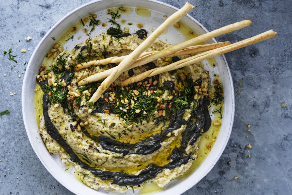 Baba ganoush with black tahini and toasted pine nuts.