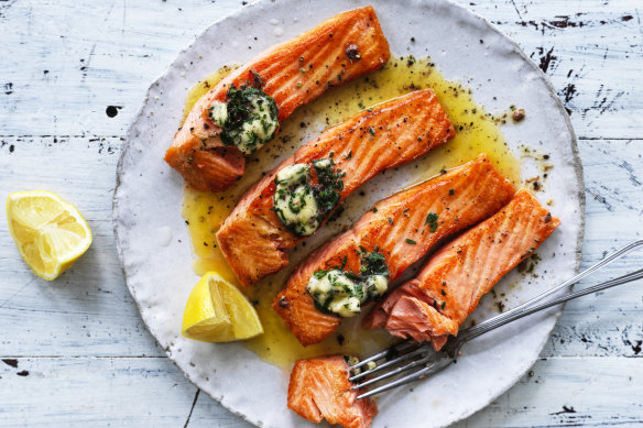 Grilled ocean trout with garlic, rosemary and anchovy butter.