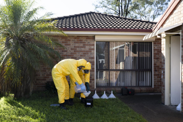 Forensic police break up a secret methamphetamine lab on a suburban street in Oakhurst, on the west side of town.