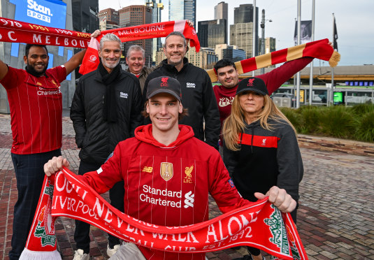 Stan commentators Craig Foster and Max Rushton with Liverpool supporters at a fan site in Federation Square.