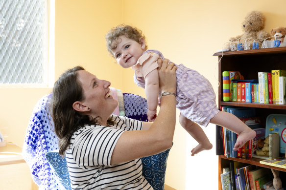 Amy McAuliffe with her daughter Bernadette, 9 months, waited three months for parental leave pay.