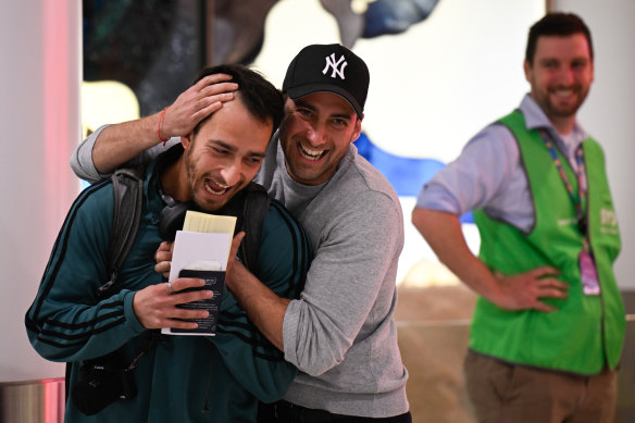 Daniel Rabinowiz hugs brother Yuval as he arrives at Sydney Airport.