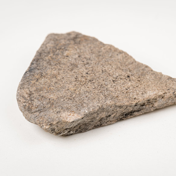 A fragment of a 30,000-year-old Wailwan grindstone used in food preparation. 