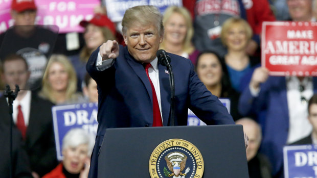 President Donald Trump at a campaign rally for Republican Rick Saccone on  Saturday, at which he mocked the idea of a commission achieving anything.