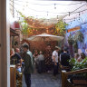 Choose a bottle from the shop to drink outside in the courtyard.
