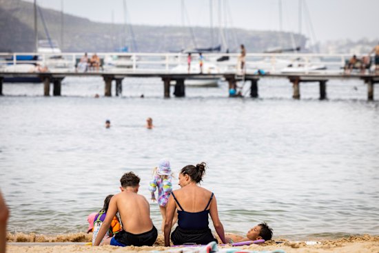 Flat and fancy: Families enjoy Balmoral Beach.