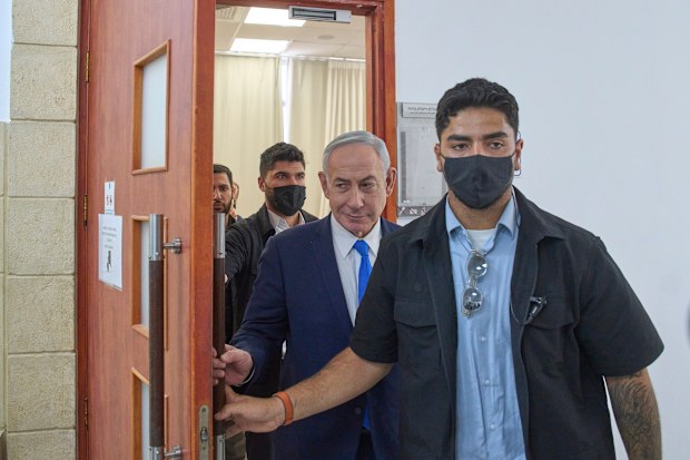 Israeli Prime Minister Benjamin Netanyahu leaves the courtroom after his hearing on corruption charges at the district court in east Jerusalem,.