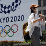Tokyo coronavirus cases surge ahead of opening ceremony