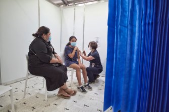 Easter Leau, 12, receives her first Moderna vaccine at the vaccination Hub in Dandenong on Sunday.