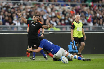 New Zealandâs Sevu Reece, is tackled by Italyâs Michele Lamaro.