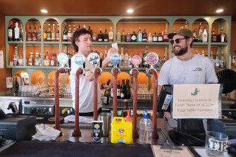 Bartenders Elias Williamson and Max Orritt at Ponyfish Island bar on Monday. 