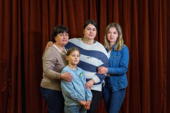 Lena Pylioenko, Svitlana Solovey, Dasha Solovey and Liza Solovey, 7, at the Saint Peter and Paul Catholic Church in North Melbourne on Sunday. 