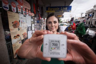 Emma Dalton measures the air quality of her local shopping strip in St Kilda East