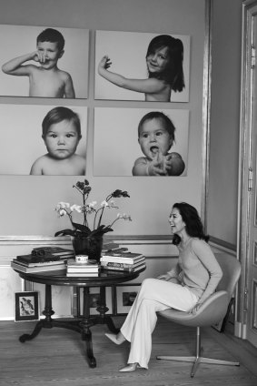 Mary, Crown Princess
of Denmark. in front of portraits of her four children - Christian, Josephine, Vincent and Isabella.