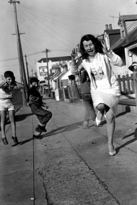 Surry Hills resident Noeline Browne gets a fright from local kids setting off bungers on May 13, 1961. 