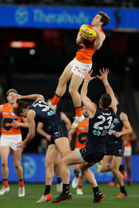 Toby Greene flies high for the Giants.