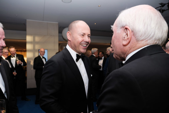 Treasurer Josh Frydenberg greets former prime minister John Howard at an AFR Business Summit dinner on Wednesday night.